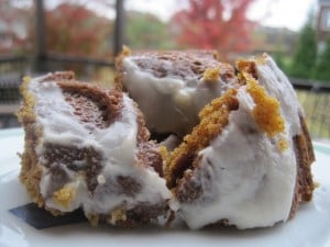 Cranberry Pumpkin Cake with Cream Cheese Frosting put back together on plate after tumble
