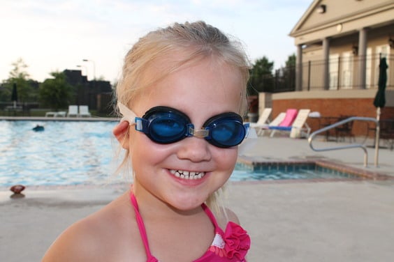 diy swimmers ear drops Swimming in the Summer - young girl wearing goggles in front of a pool