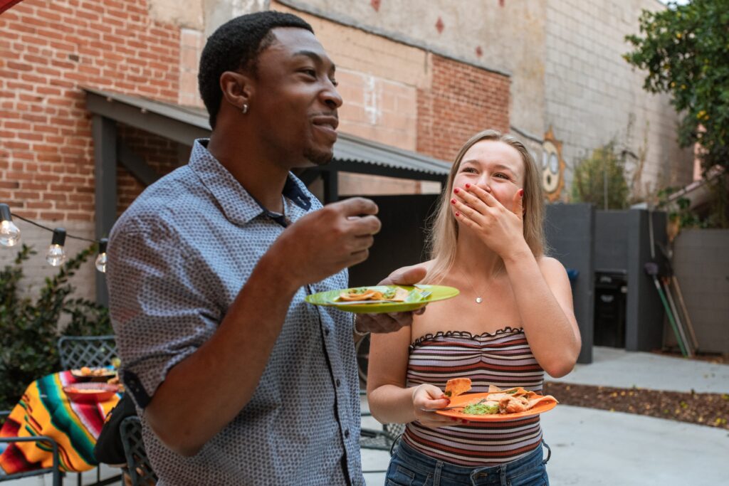 people enjoying slow cooker nachos