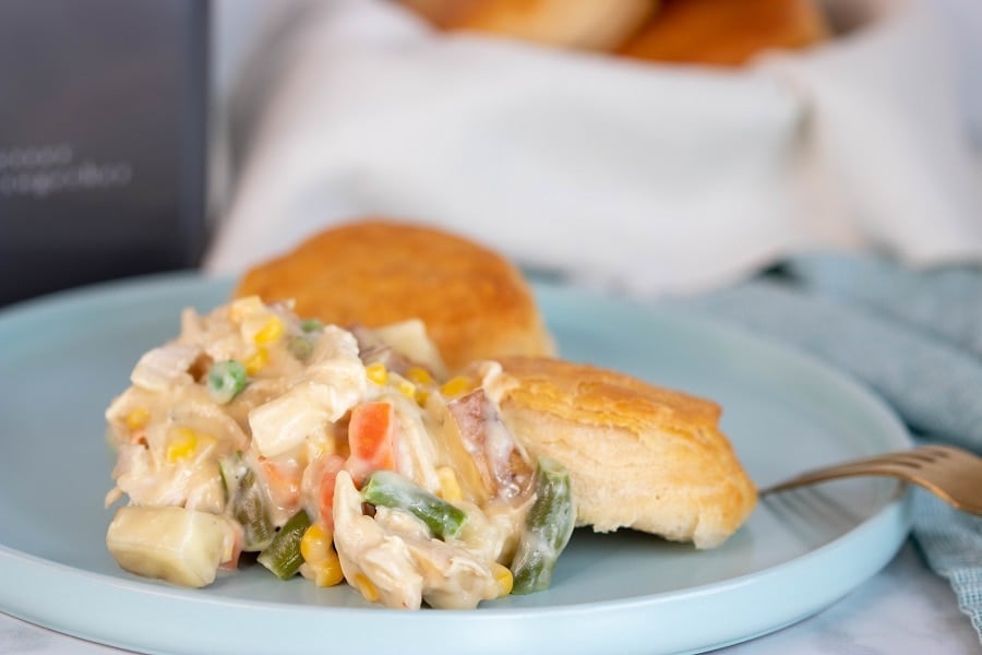 finished chicken pot pie on plate with biscuits