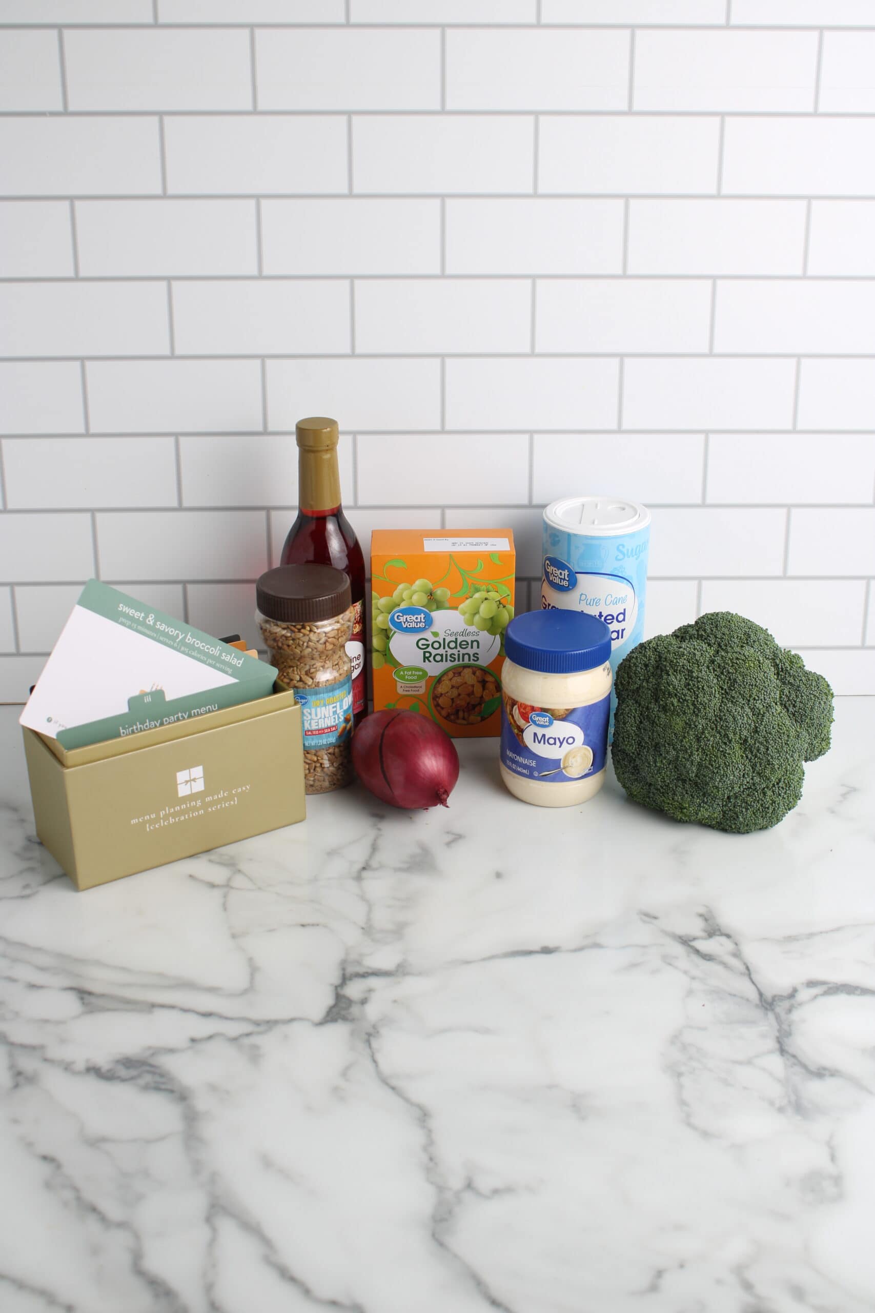 sweet and savory broccoli salad ingredients on countertop