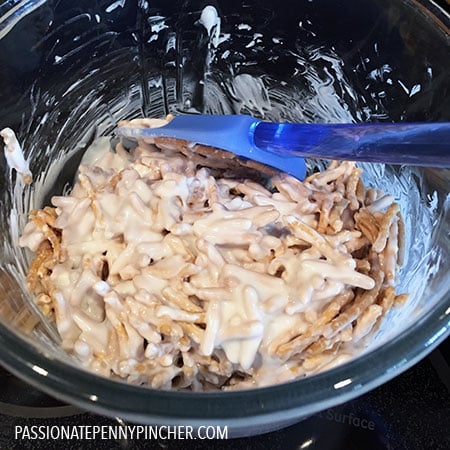 mixing chow mein and chocolate in mixing bowl