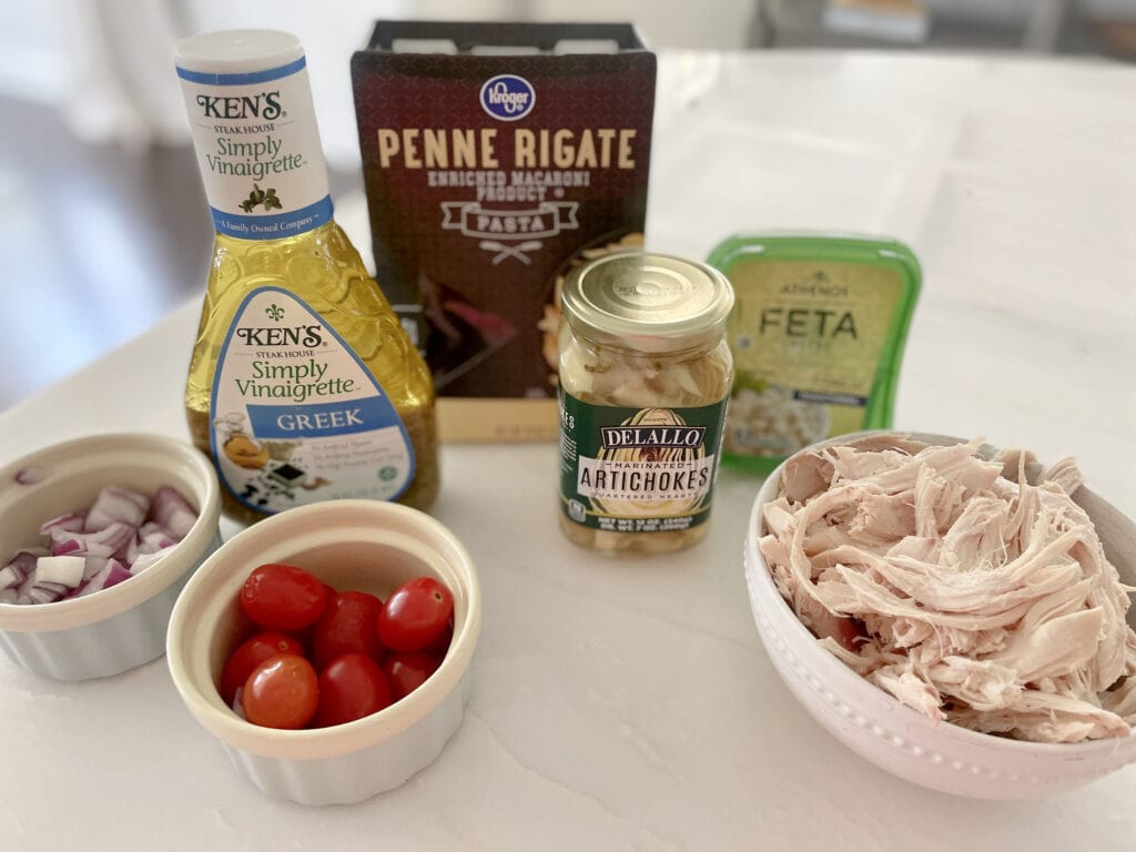Greek Chicken Pasta Salad Ingredients on Counter 