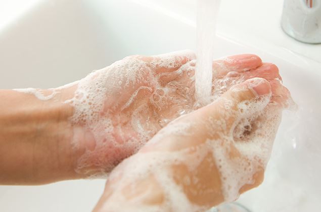 soapy hands under water 