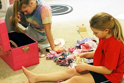 American Girl Doll Clothes in a bin