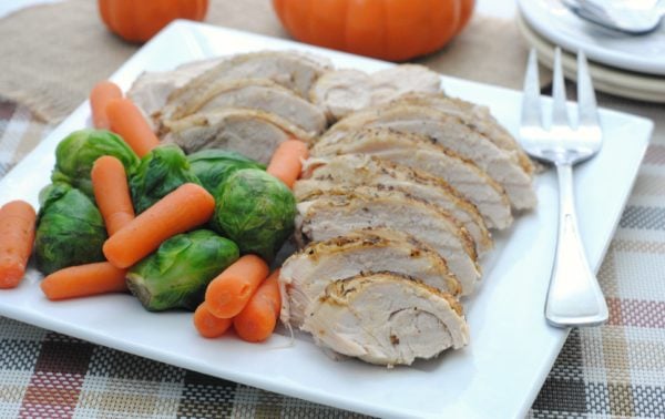 slow cooker turkey breast with vegetables on plate