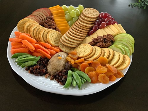 Turkey Appetizer Tray - meat, cheese, crackers, veggies, and fruits shaped like a turkey