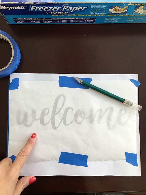 taping stencil on cutting board