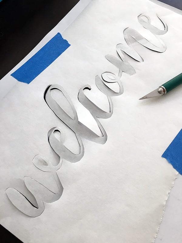 weeding stencil with xacto knife