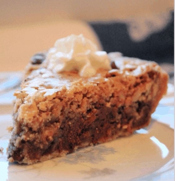Pecan Pie with Chocolate Chips on Plate with Whipping Cream