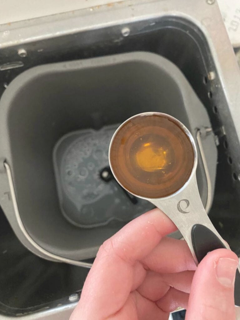 Adding items to bread machine to make bread