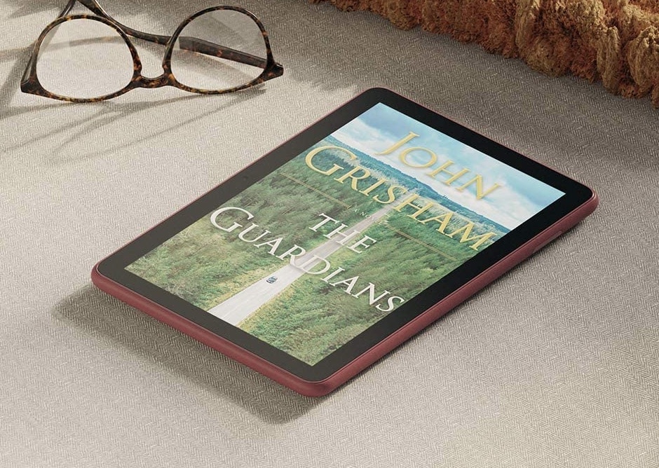 Kindle Fire 8 on floor with glasses near