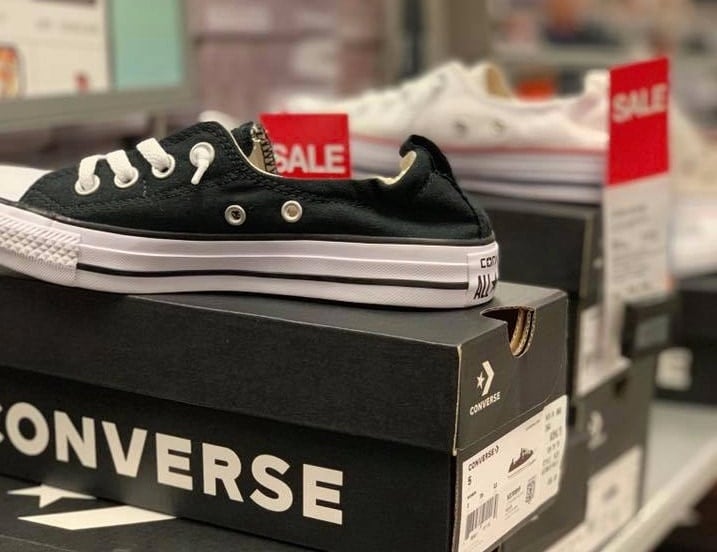 Converse shoe sitting on Converse box in store
