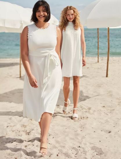 Calvin Klein Dresses 2 woman on beach in white dresses