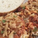 cheesy baked spaghetti on plate