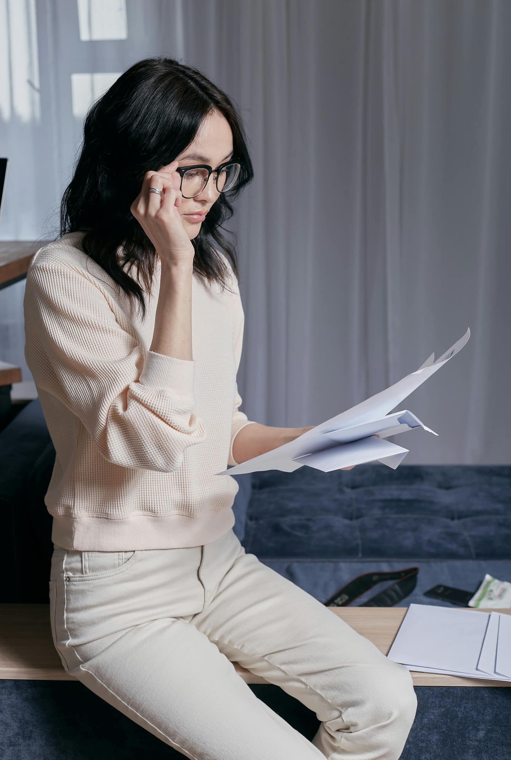 woman looking at credit report