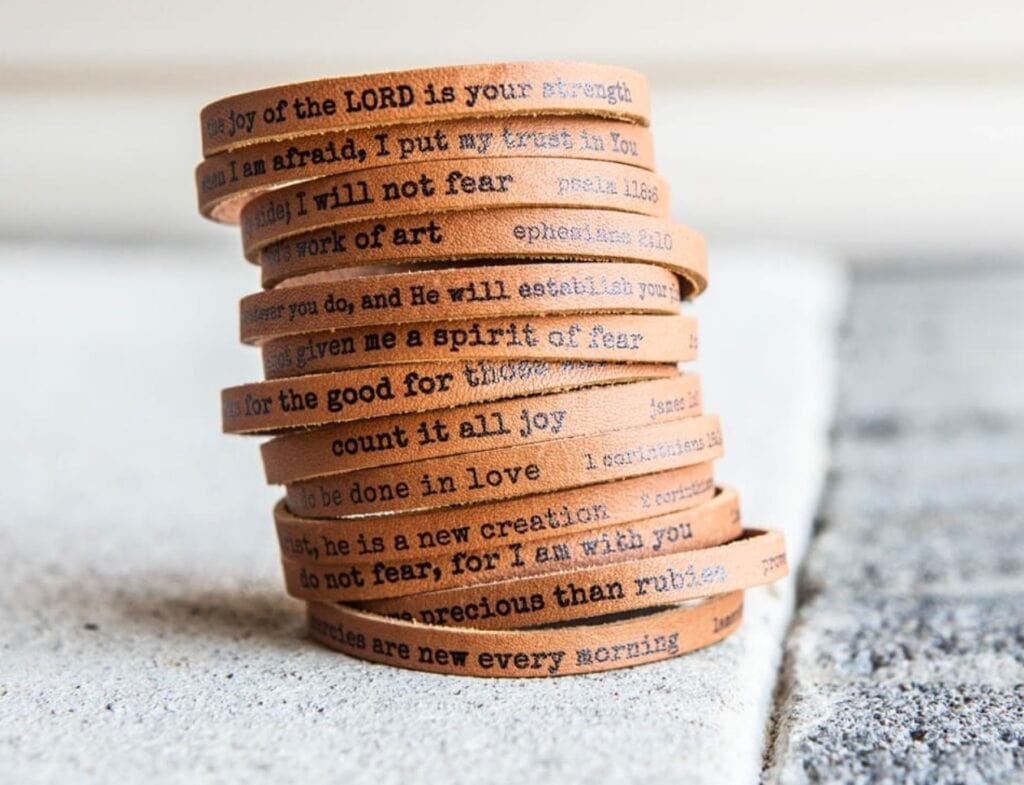 leather scripture bracelets stacked up on top of each other vertically