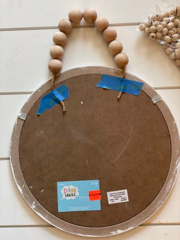 Attaching garland to sign