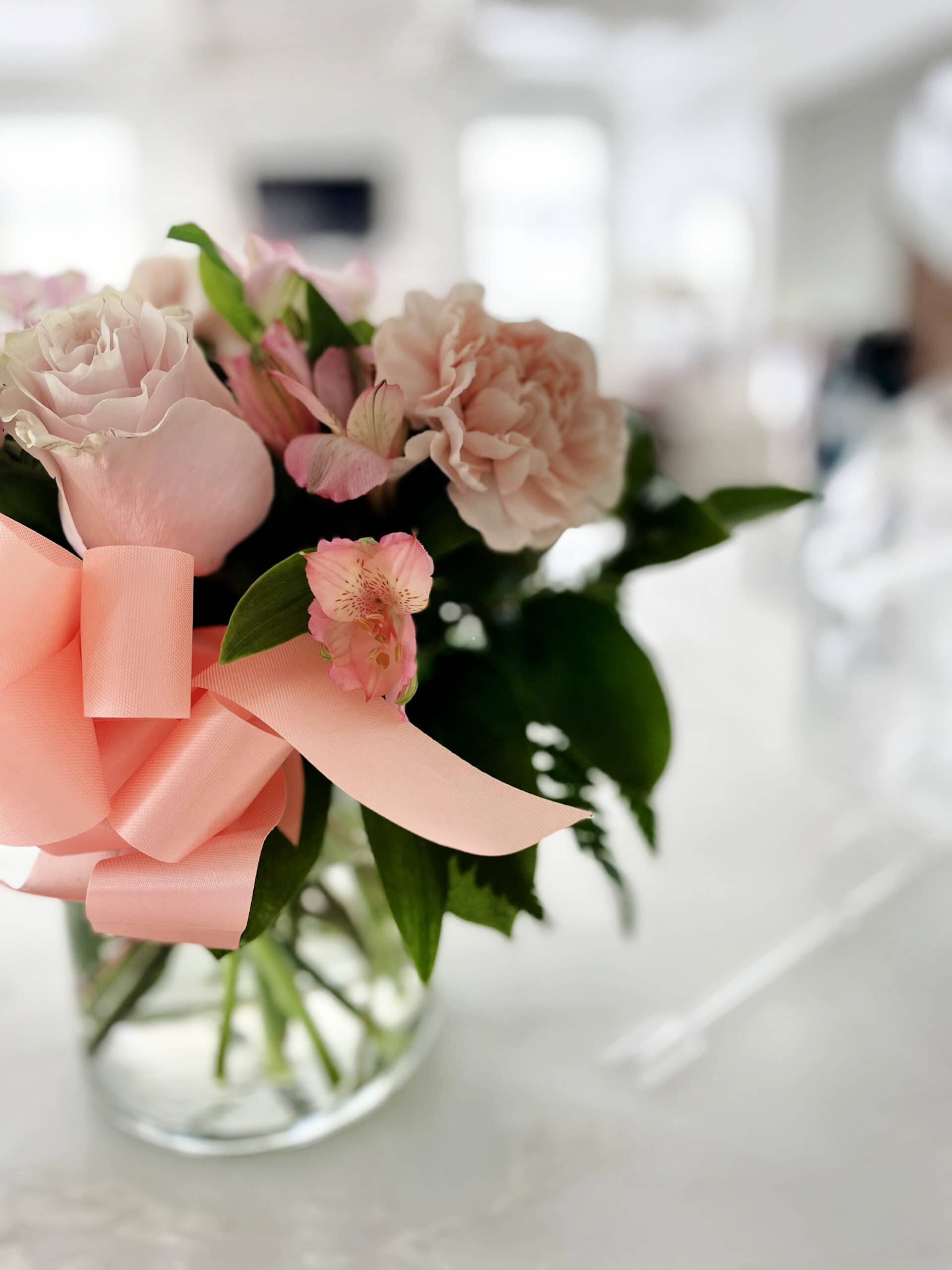 flowers in vase on counter 