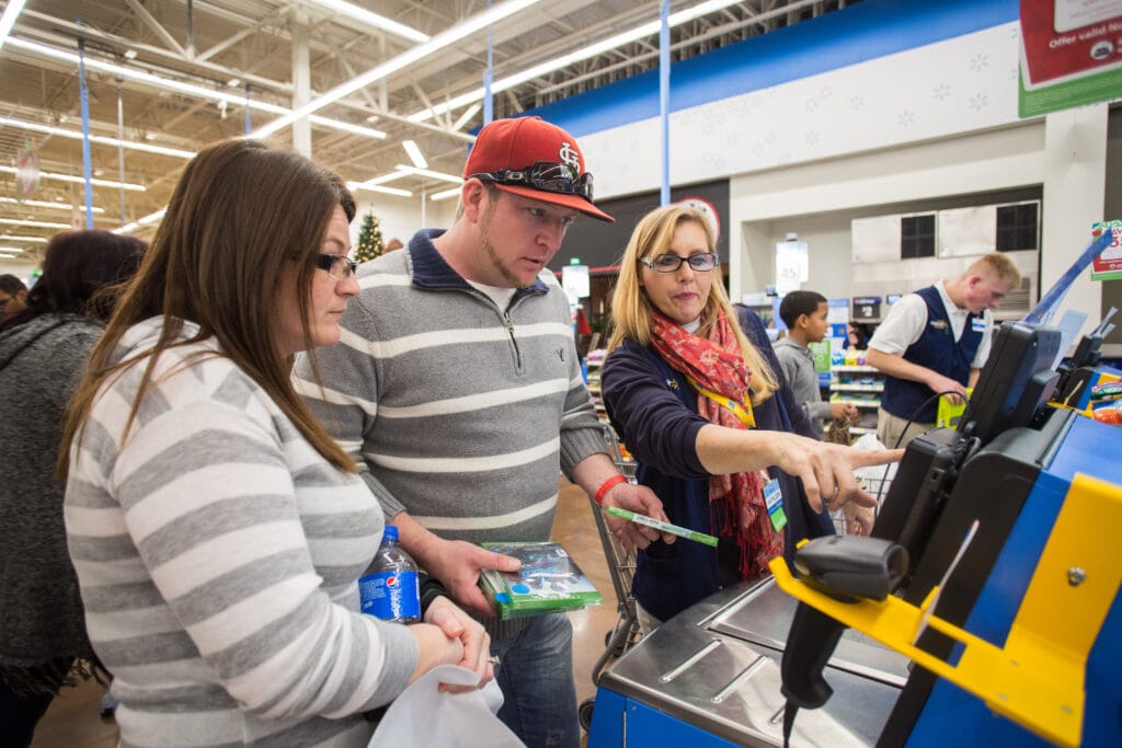 man and woman checking out at walmart