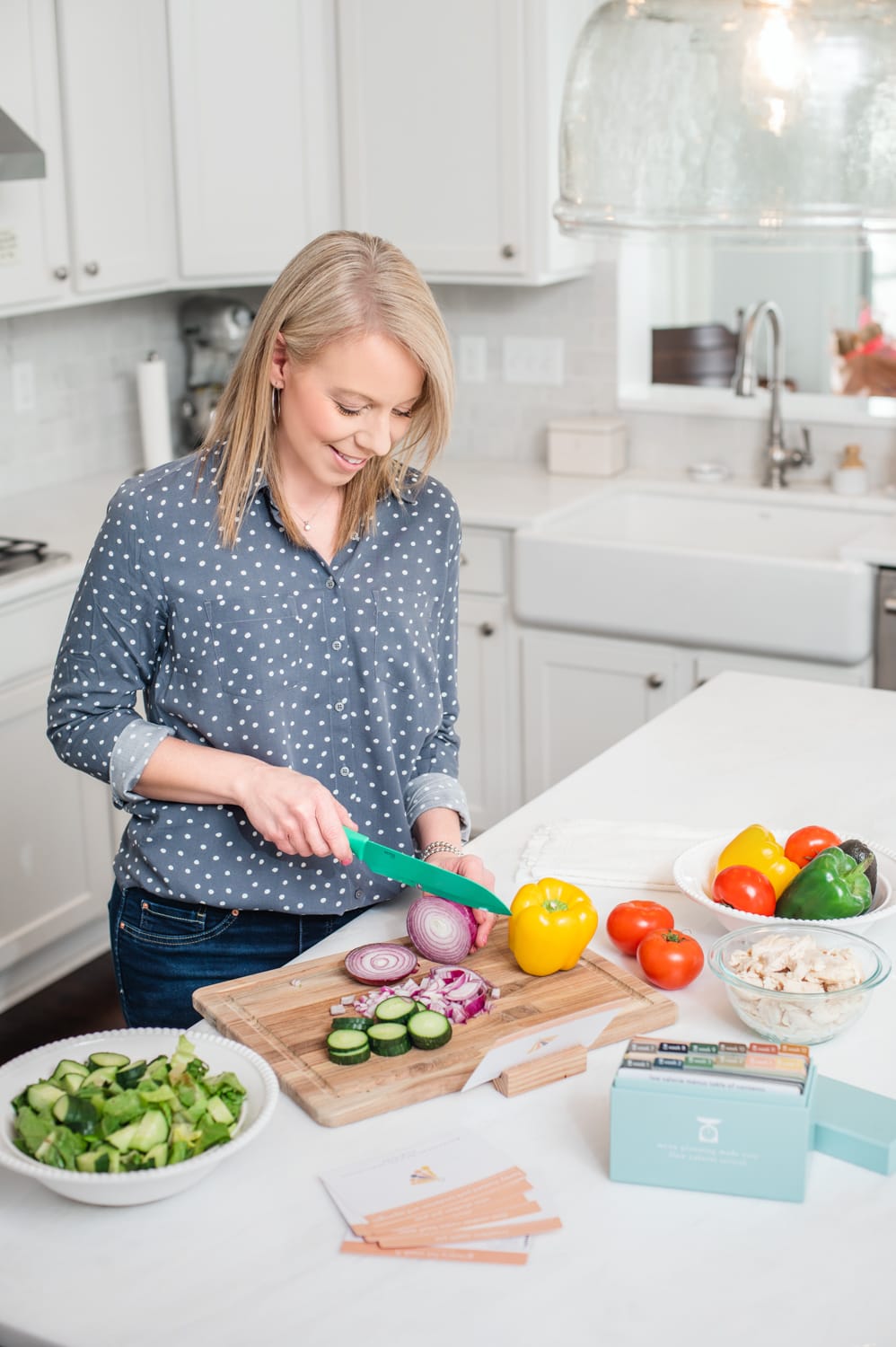 Low calorie menu box with Laurie cutting veggies