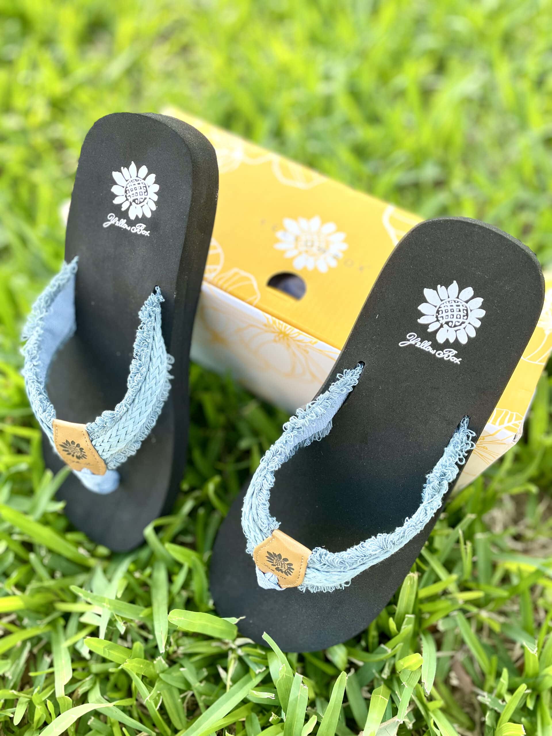 yellow box sandals with box on grass