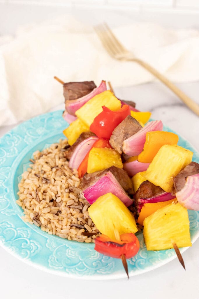 Finished Kabobs Over Rice on Plate