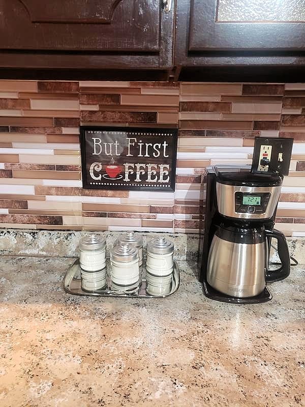 brown backsplash with coffee maker
