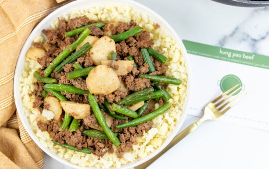 kung pao beef Finished on Plate with fork and Recipe Card