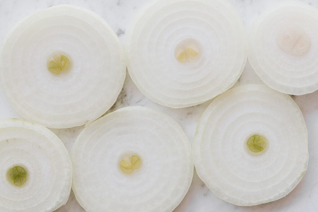 sliced onions on tray