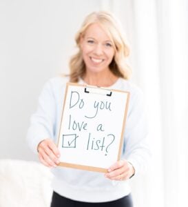 Laurie holding sign that says, "Do you love a list?"