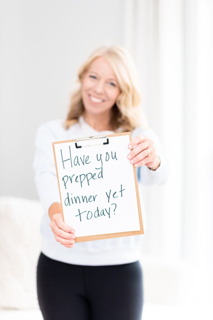 Laurie holding a sign that says, "have you prepped dinner yet today?"