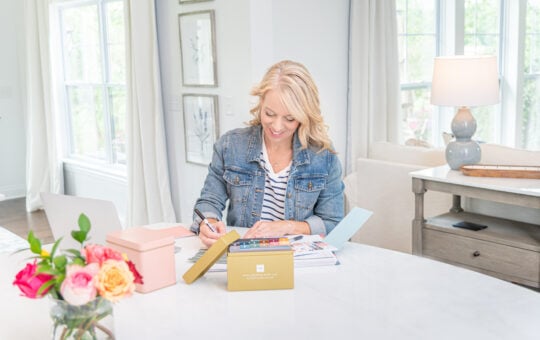 Laurie at counter with celebration menu plan