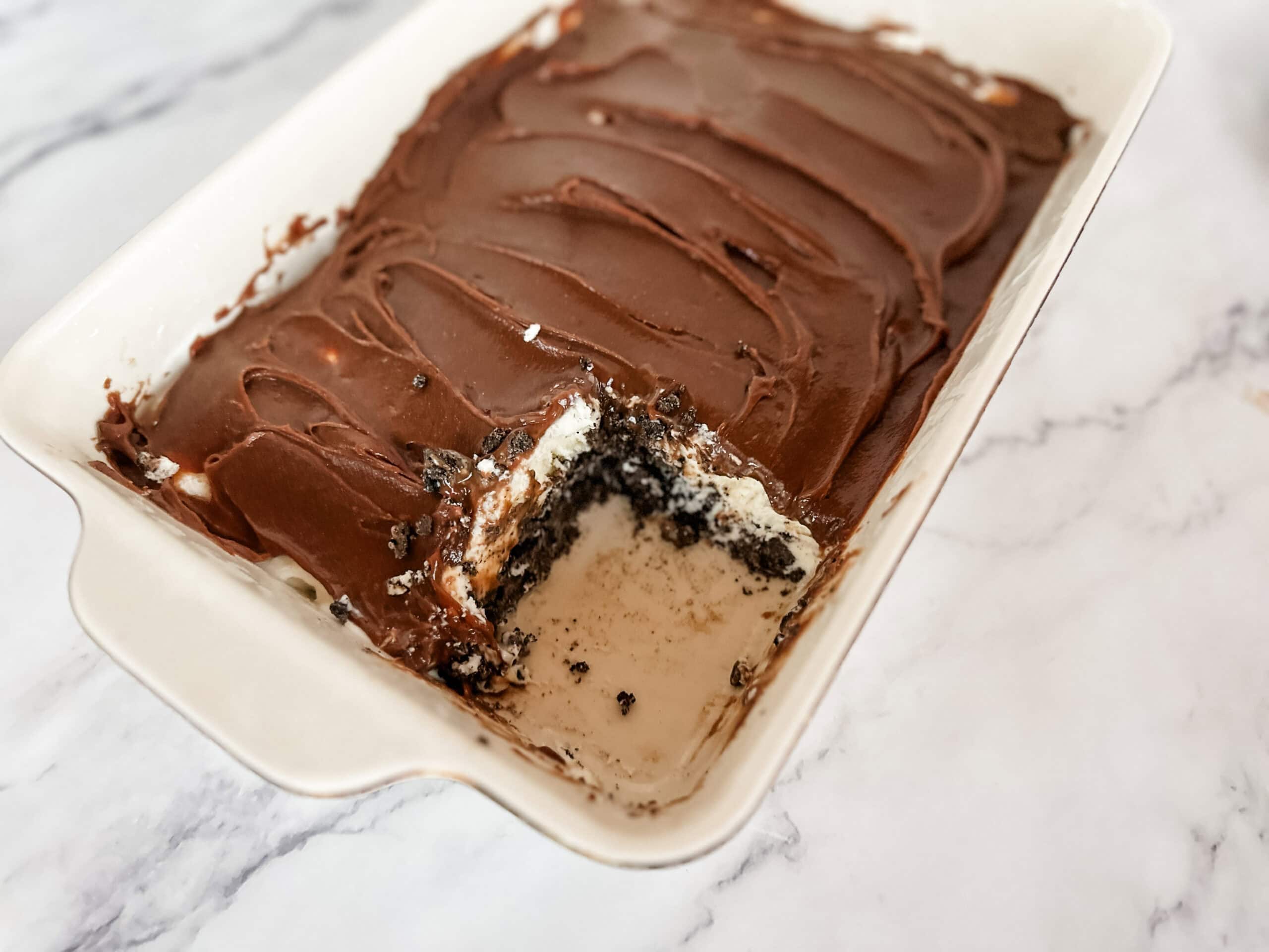 mudslide dessert in cake pan with piece missing