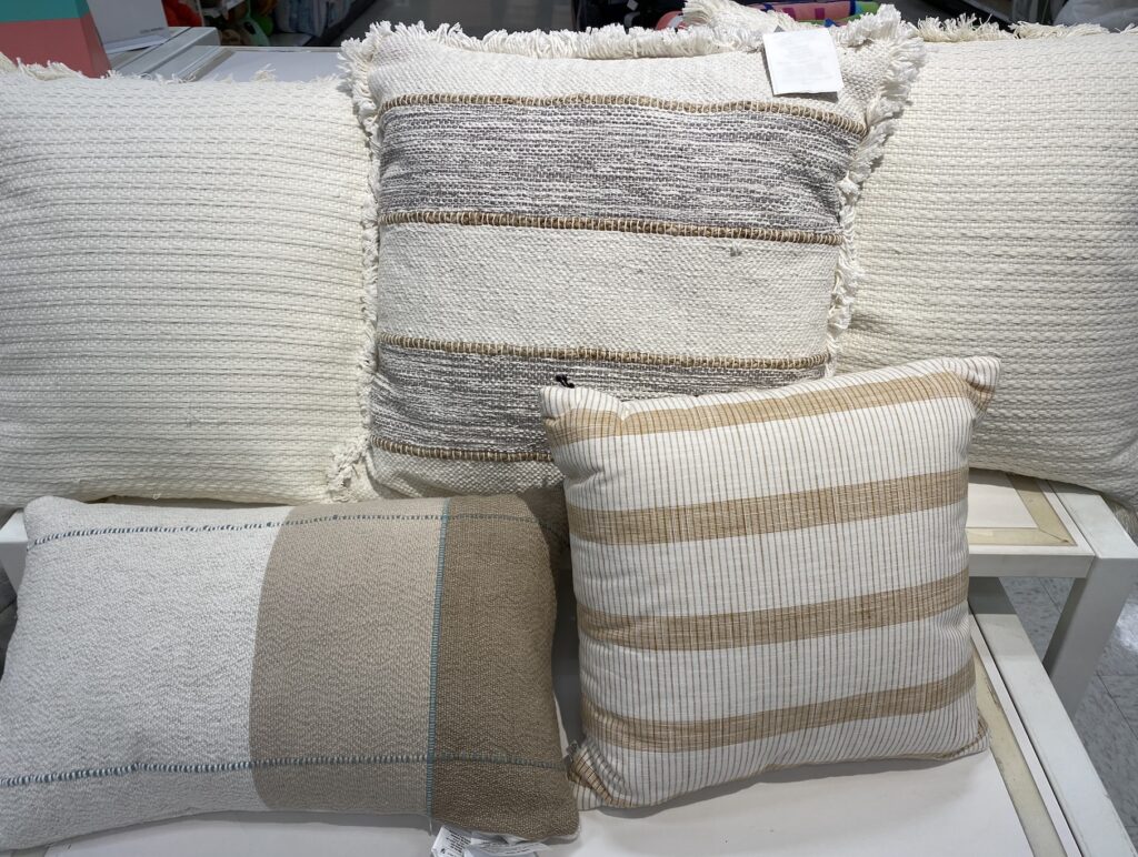 stack of throw pillows with stripes 