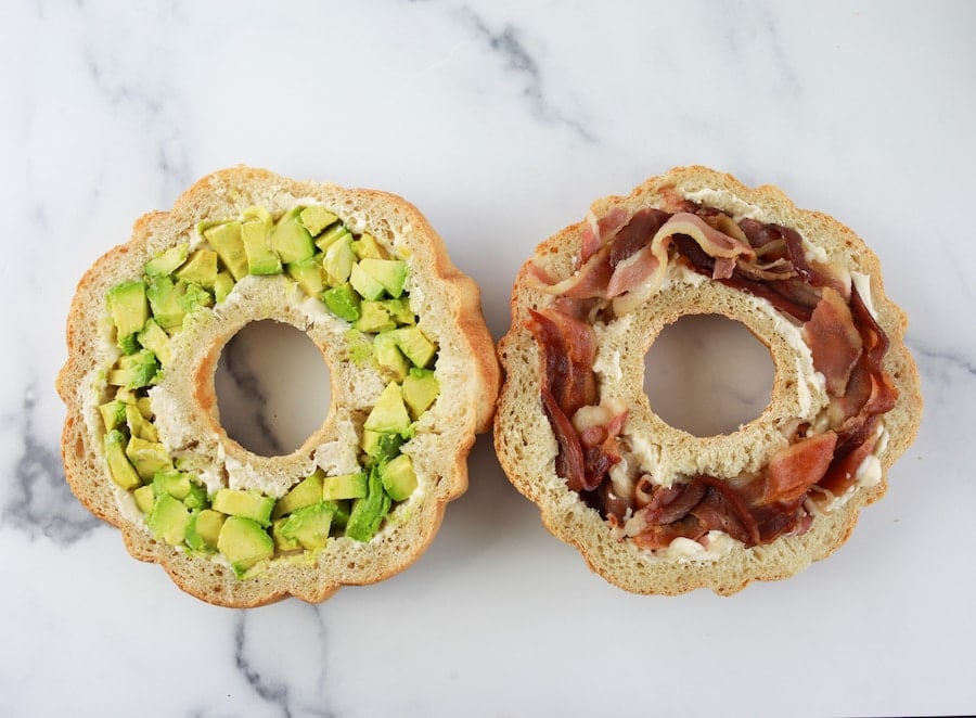 Adding toppings to party sandwiches 