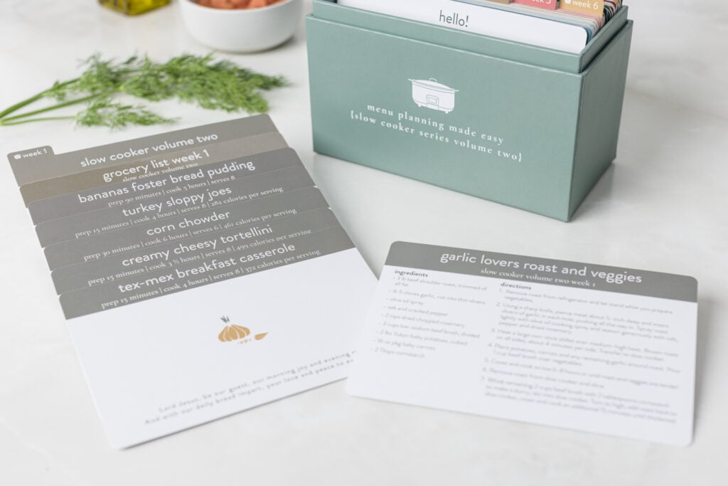 Slow cooker volume 2 box with grocery list and recipes on kitchen counter