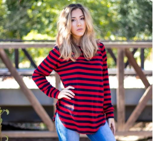 Red and black Striped oversized top on young woman