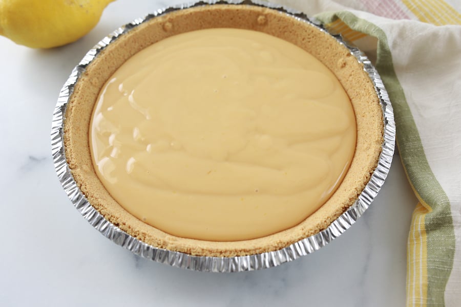 custard filling into pie crust