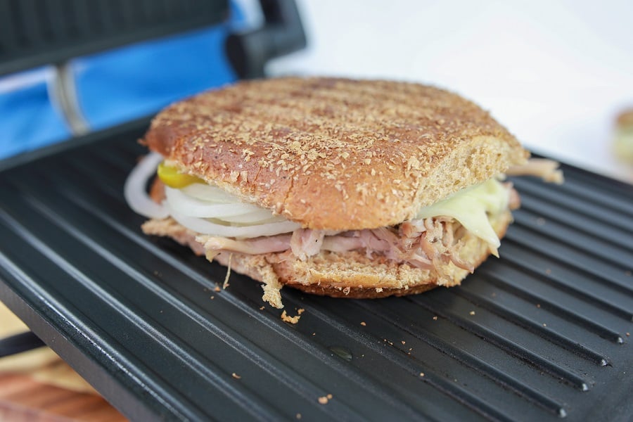 cuban pork sandwich on the griddle