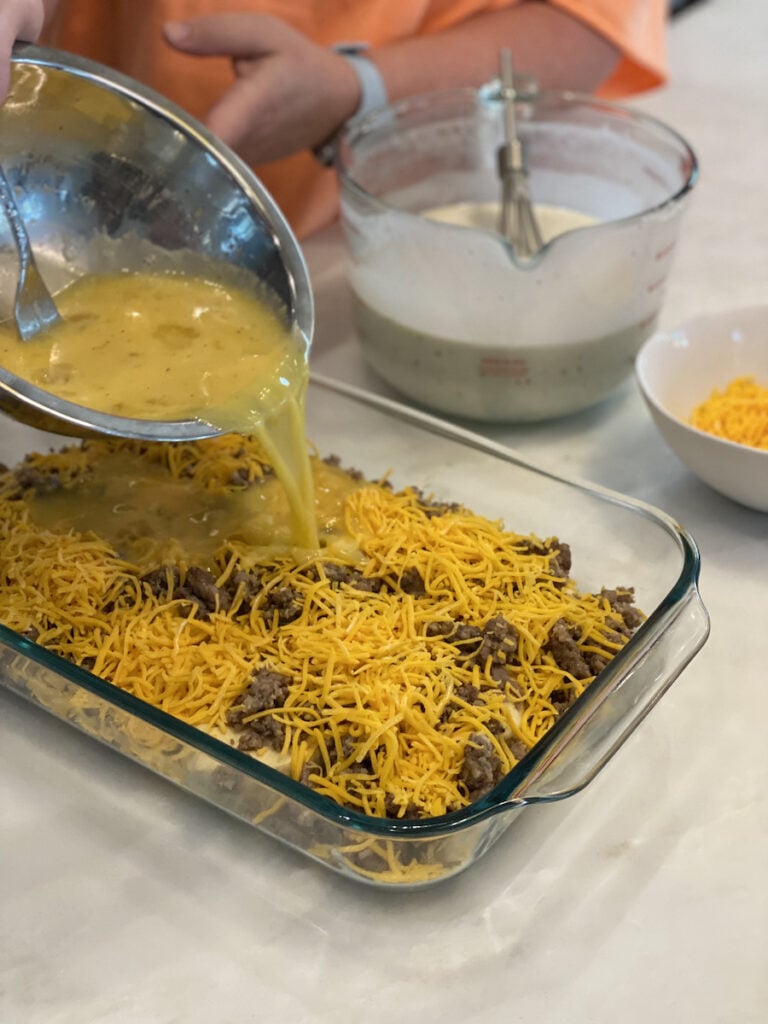 casserole pouring egg on casserole