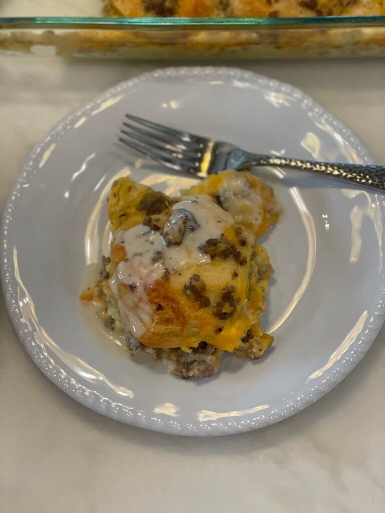 Biscuits and Gravy on white plate with fork