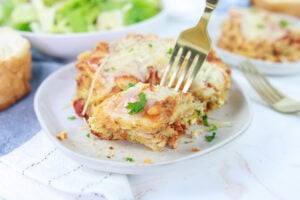 Pesto Lasagna on Plate with Fork in Lasagna