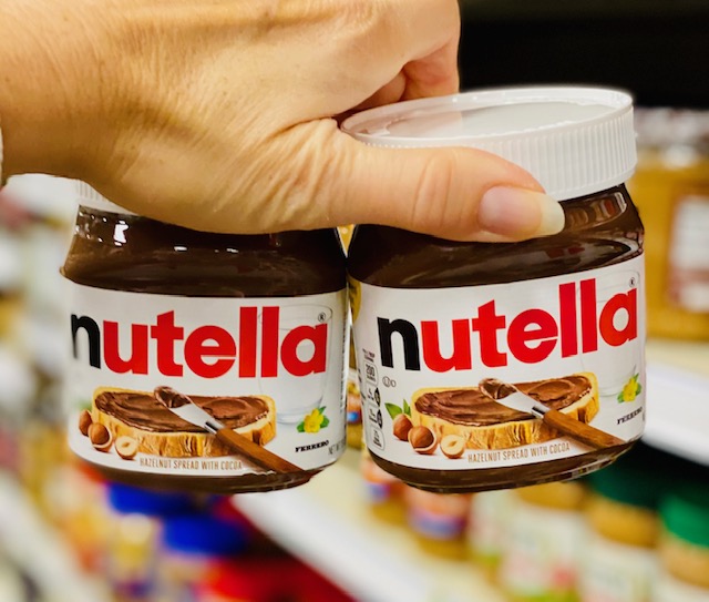 holding 2 nutella spreads