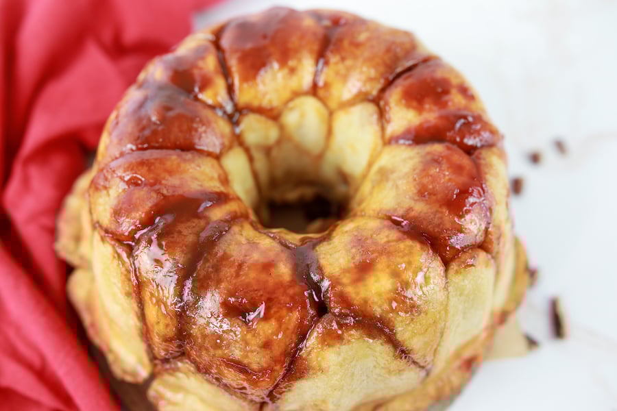 pull apart cinnamon rolls on plate with glaze