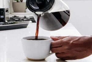 coffee being poured into coffee cup
