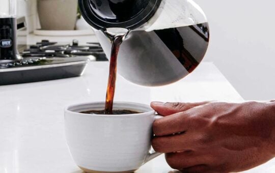 coffee being poured into coffee cup