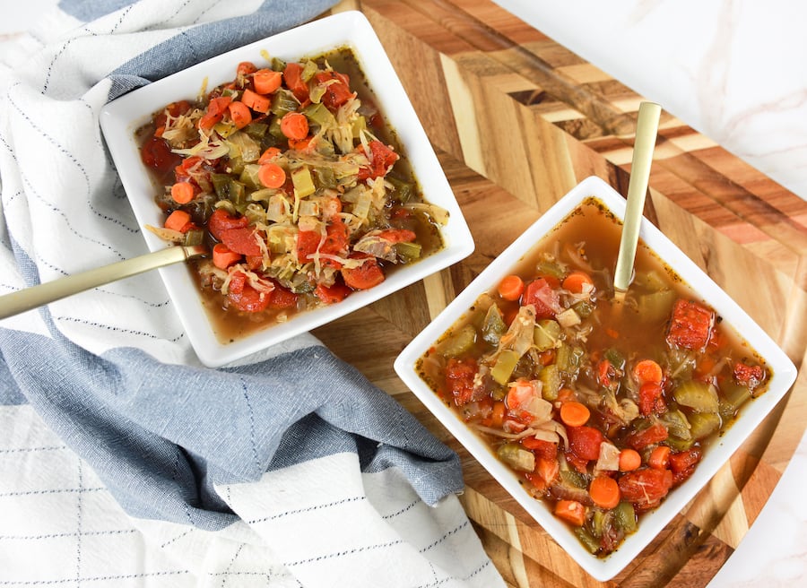 crockpot cabbage soup in white square bowls