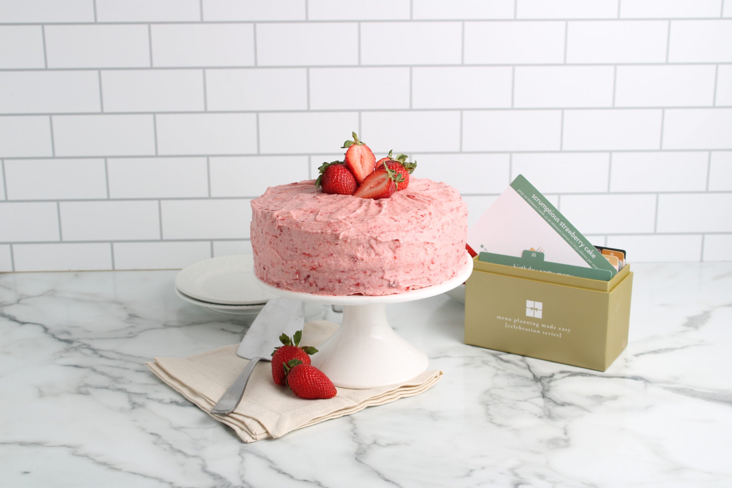 strawberry cake on platter 