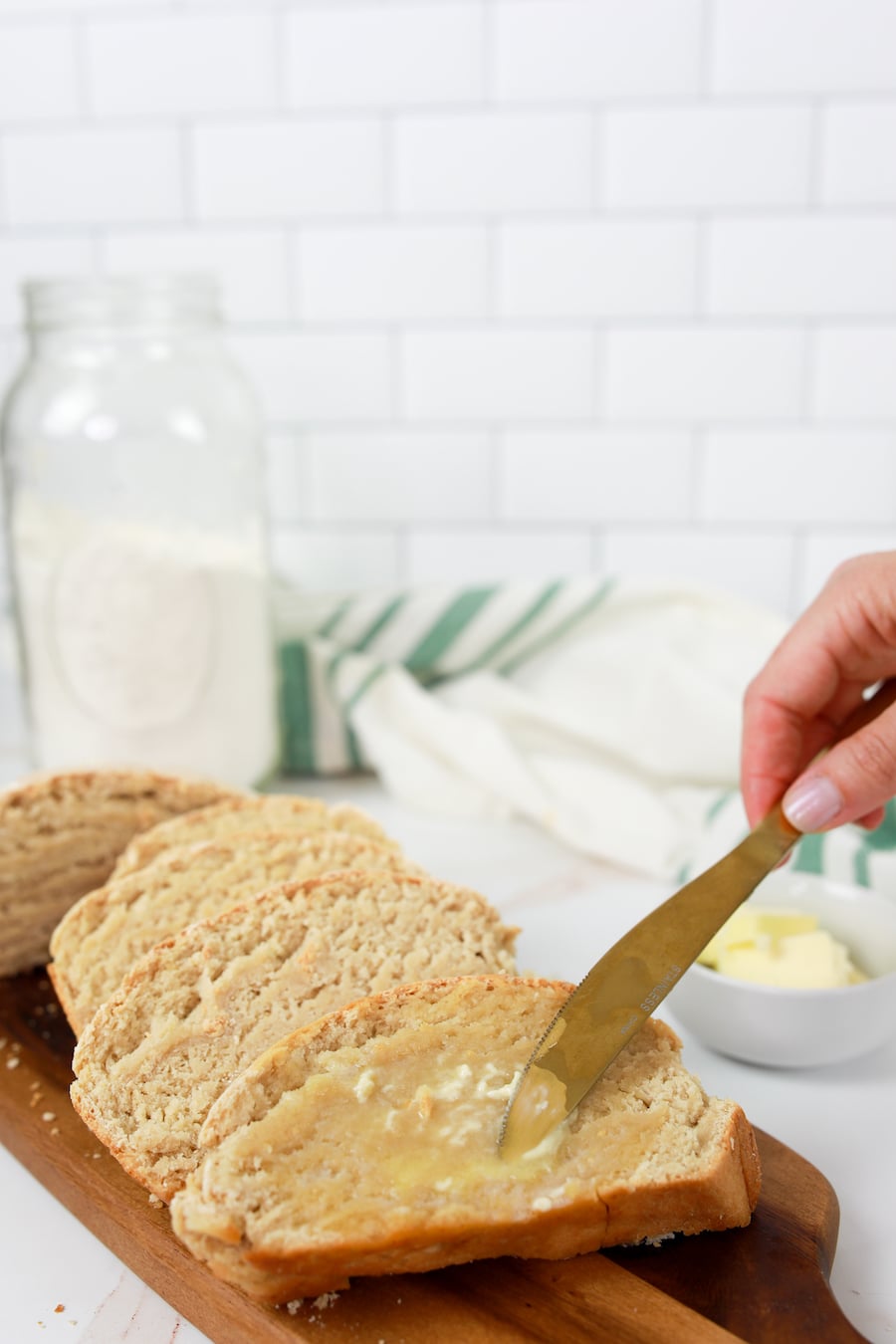 buttering homemade bread
